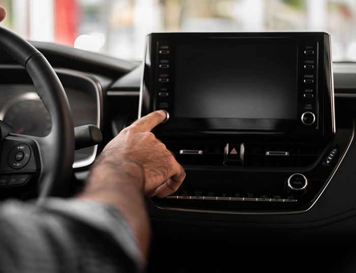 Hand operating an in-car touchscreen
